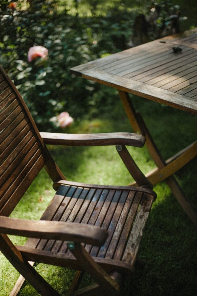 Yard Perimeter Defense 1 Wooden patio furniture set up outside in spring/summer.